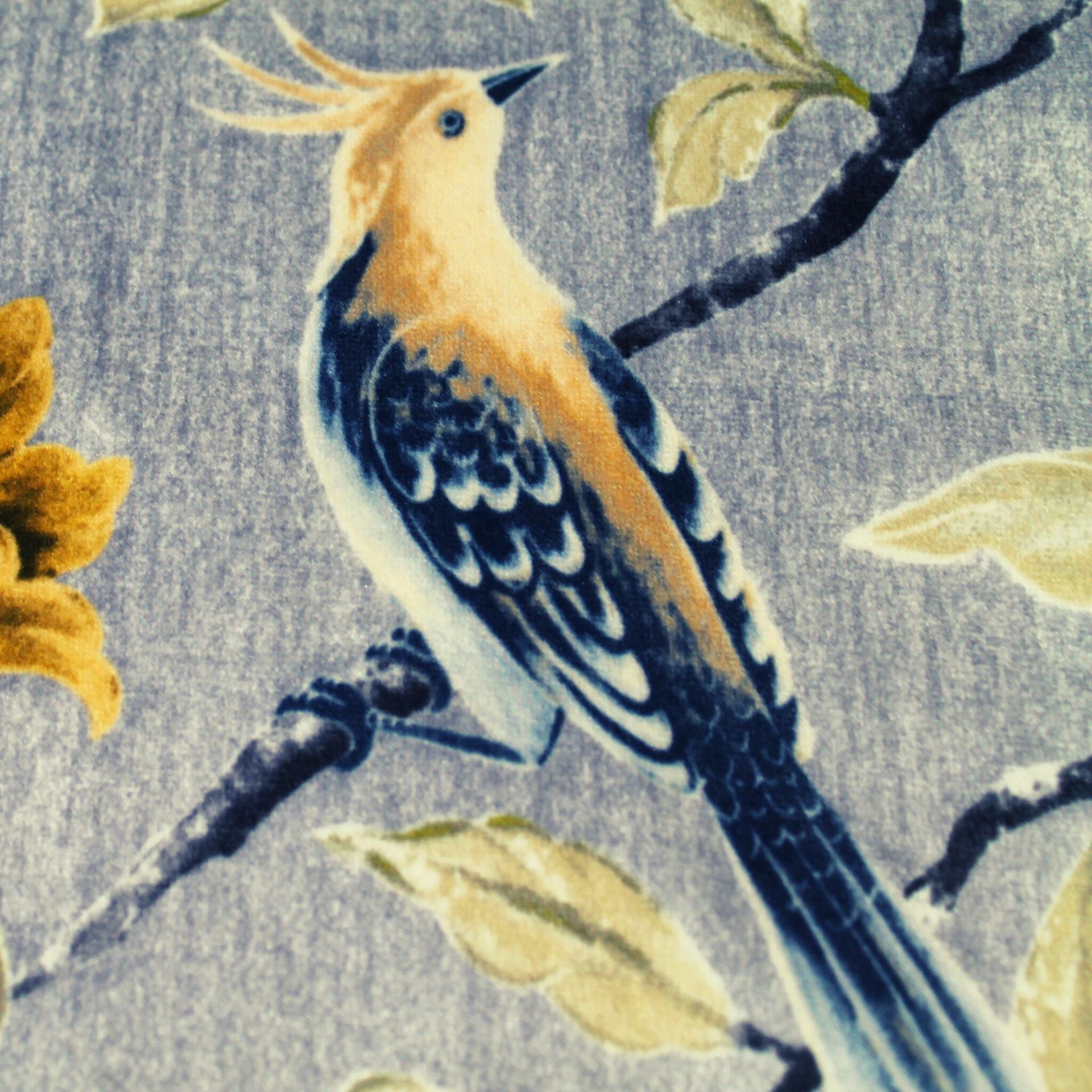 bird print upholstery fabric in muted tones of greige and blue grey.
